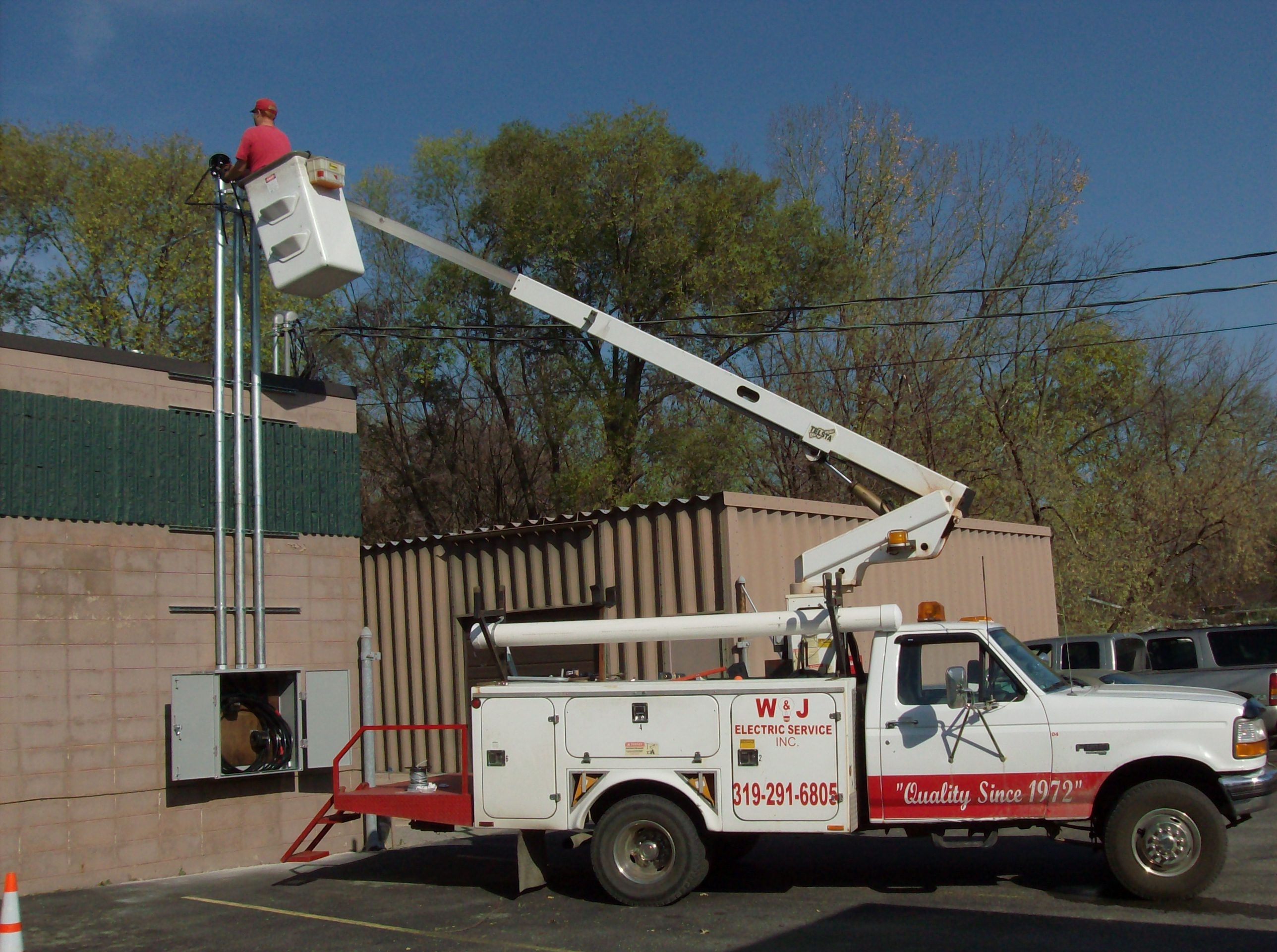 This is our bucket truck.  Also shown is an 800 amp electrical service on a commercial building.